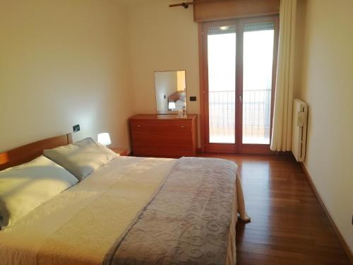Ένα ή περισσότερα κρεβάτια σε δωμάτιο στο Holiday Apartment Agripolis Venice Padua