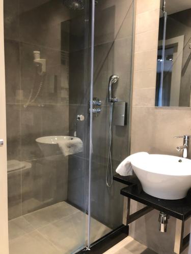 Koupelna v ubytování Hotel Le Cygne d'Argent