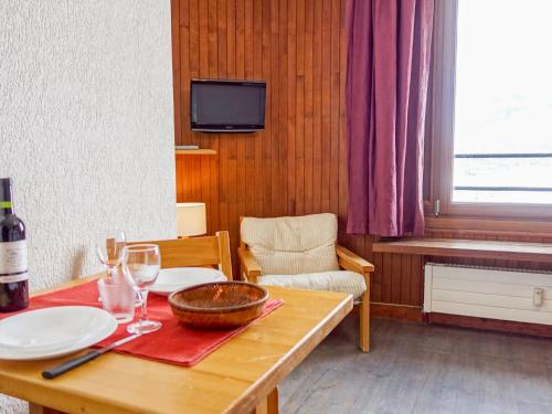 a dining room table with glasses and a bowl on it at Studio Les Moutières B1 et B2-8 by Interhome in Tignes