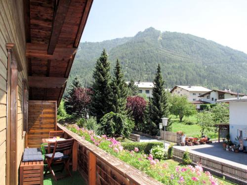 a balcony of a house with a view of a mountain at Apartment Haus Grazia - PTZ154 by Interhome in Prutz