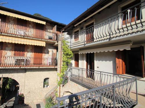 a group of buildings with balconies and a staircase at Apartment Adalgisa-1 by Interhome in Tignale