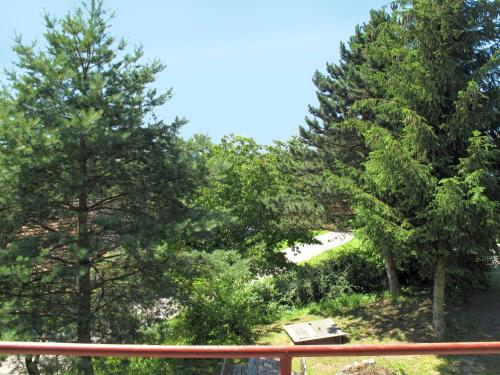 a view of a park with trees and a bench at Holiday Home Jitka by Interhome in Jablonné nad Orlicí