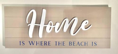 a sign that reads shine is where the beach is at On the Beach Motel in Old Orchard Beach