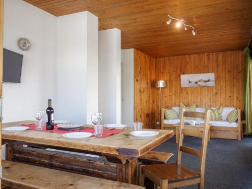 a dining room with a table and a couch at Apartment La Grande Casse-2 by Interhome in Tignes