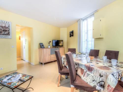 a dining room with a table and chairs at Apartment Orléans by Interhome in Trouville-sur-Mer