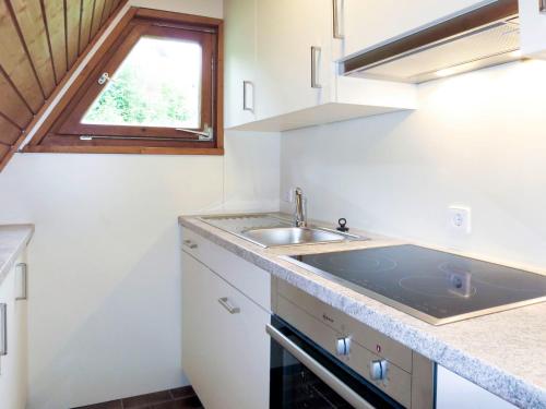a small kitchen with a sink and a window at Holiday Home Pfrungen by Interhome in Pfrungen