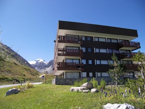 a building with rocks in front of it at Apartment La Grande Casse - Lavachet-3 by Interhome in Tignes