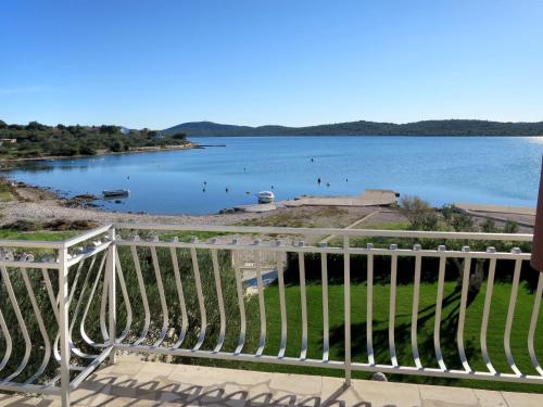 a view of a lake from a balcony at Holiday Home Julija - VOD300 by Interhome in Pirovac