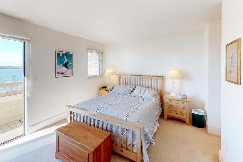 a bedroom with a bed and a large window at Kings Grant -- 40058 Grant Dr #46 in Fenwick Island