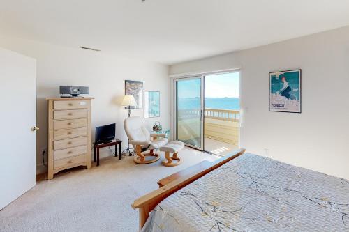 a bedroom with a bed and a desk and a window at Kings Grant -- 40058 Grant Dr #46 in Fenwick Island