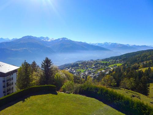 a view of a valley with mountains in the background at Apartment Clair-Azur-2 by Interhome in Randogne