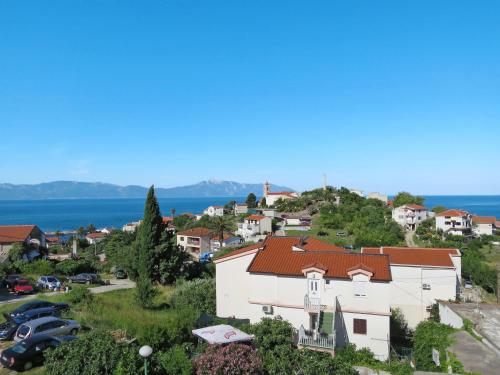 arial view of a small town with a white building at Apartment Rudez-1 by Interhome in Gradac