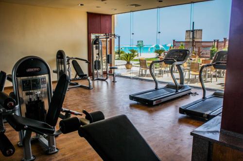a gym with cardio equipment in a hotel room at Beau Site Belle Vue Hotel in Marsa Matruh