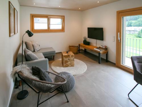TV a/nebo společenská místnost v ubytování Apartment Kinast - HFT201 by Interhome