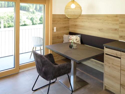 a dining room with a table and two chairs at Apartment Kinast - HFT201 by Interhome in Hofstetten