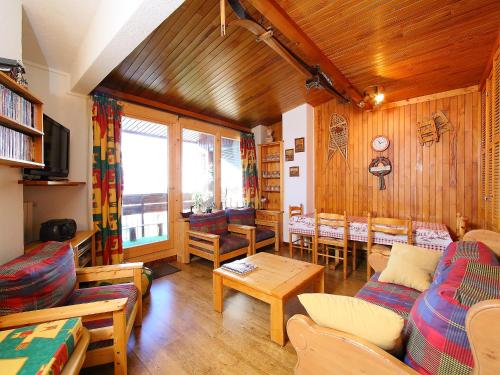 a living room with a couch and a table at Apartment Le Curling A - Val Claret-17 by Interhome in Tignes