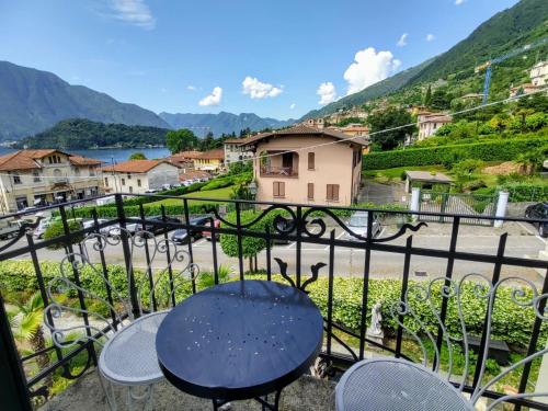a view from a balcony with a table and chairs at Apartment Villa Costanza-3 by Interhome in Mezzegra