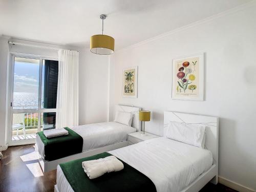 Postel nebo postele na pokoji v ubytování Lido Life Apartment by LovelyStay
