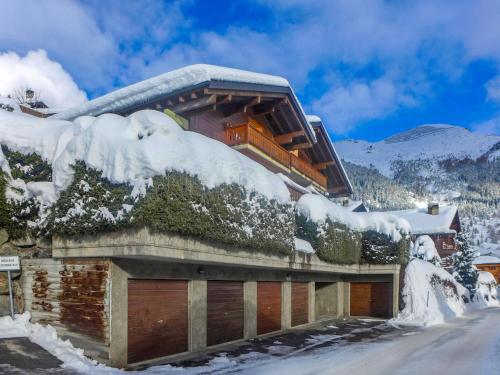 a building covered in snow on a mountain at Apartment Licorne 13 by Interhome in Verbier