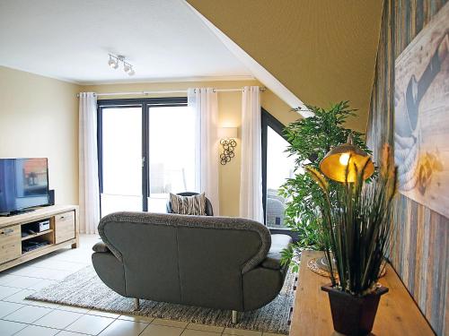 Televisyen dan/atau pusat hiburan di Apartment Witthuus-Spiekeroog by Interhome