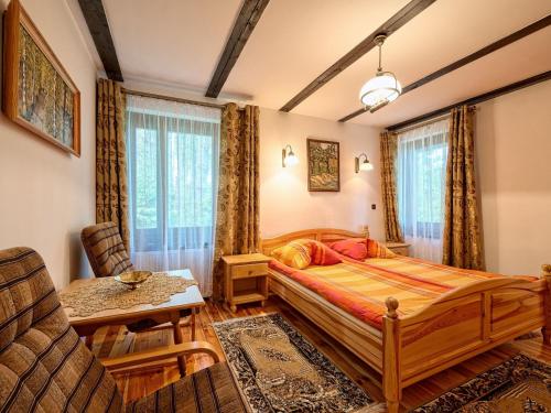 Giường trong phòng chung tại Holiday Home Trzy Brzozy by Interhome