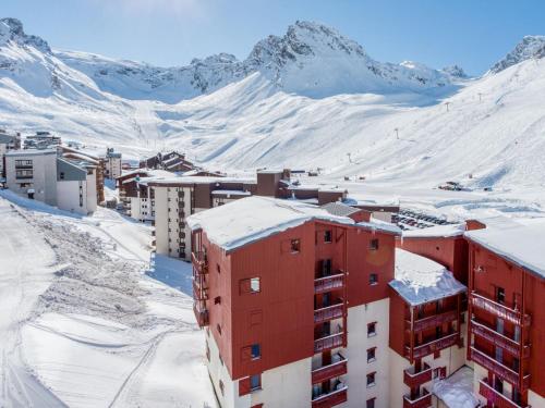 a city in the snow with mountains in the background at Apartment Les Grandes Platières-22 by Interhome in Tignes