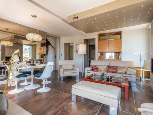 a living room with a couch and a table at Apartment Les Néréïdes-1 by Interhome in Quiberon
