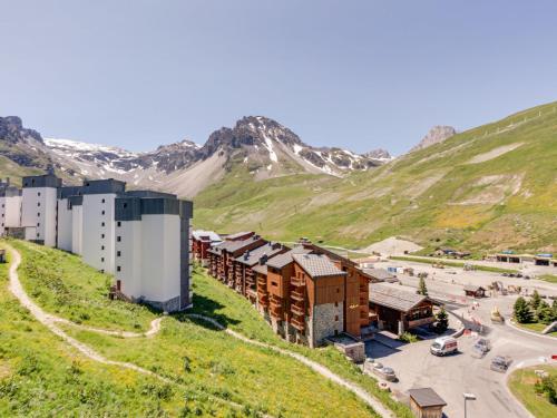 a group of buildings on a hill with a mountain at Apartment Le Schuss - Val Claret-5 by Interhome in Tignes