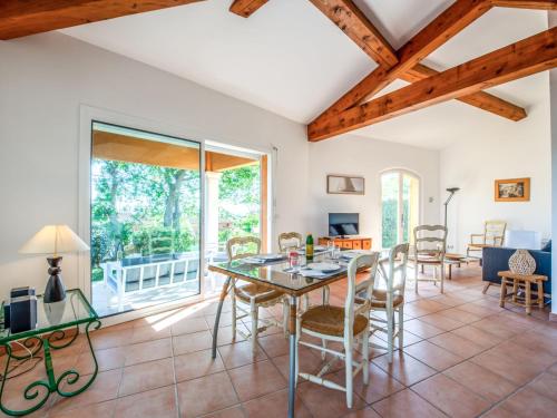 a large living room with a table and chairs at Holiday Home Parc de la Rouveraie by Interhome in Saint-Tropez