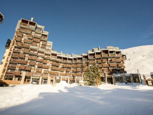 a large building in the snow in the snow at Studio Le Curling A-21 by Interhome in Tignes