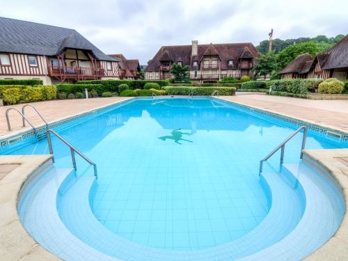 an image of a swimming pool at a resort at Apartment Domaine de Clairefontaine-3 by Interhome in Deauville