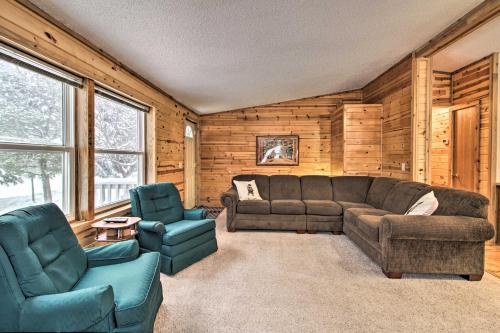a living room with a couch and two chairs at Cozy Crosby Cabin Near Serpent Lake and Main St in Crosby