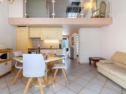 a kitchen and living room with a table and chairs at Apartment Tasman S12-2 by Interhome in Bouveret