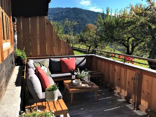 a patio with a couch and a coffee table at Chalet Feldkasten by Interhome in Dorf