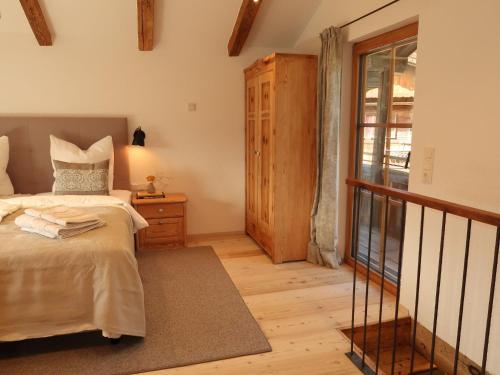 a bedroom with a bed and a window at Chalet Feldkasten by Interhome in Dorf