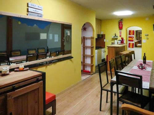 a kitchen and dining room with a table and chairs at Apartment Rosablanche-108 by Interhome in Siviez
