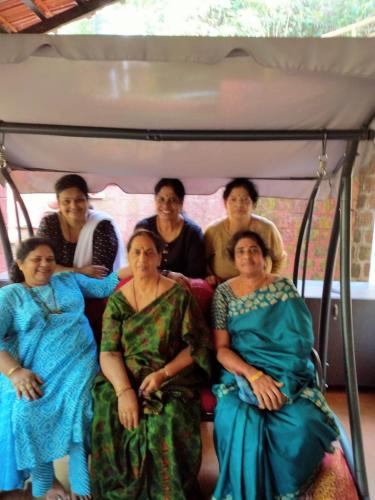 a group of people sitting on a bus at NIDHIVANA FARMS & RESORT, bakrebail-salethoor rd, Mangalore in Mangalore
