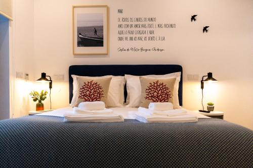a bedroom with a bed with two towels on it at Oliva Teles 53 - Sophia Terrace in Arcozelo