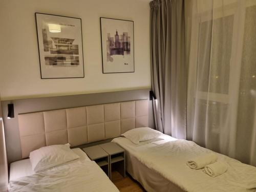 Posteľ alebo postele v izbe v ubytovaní Apartament Wolska Warszawa blisko centrum WiFi, AC, parking, Apartment in Warsaw very close to the center