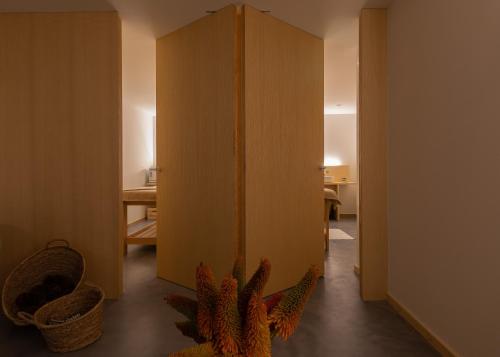 a room with a door with a plant in it at Hotel Meira in Vila Praia de Âncora