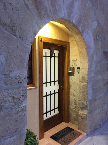 an entrance to a door in a stone building at Cal Sabater in Preixana
