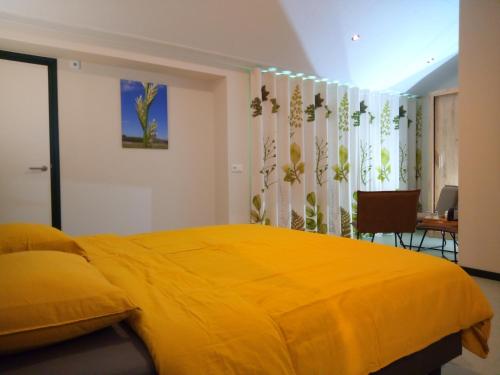 Postel nebo postele na pokoji v ubytování B&B In de Wei