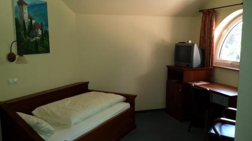 Ein Bett oder Betten in einem Zimmer der Unterkunft Hotel Restaurant Am Pfauenhof