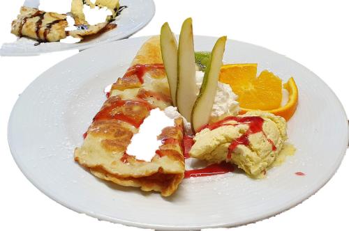 two plates of food on a white plate at Gasthaus & Hotel Drei Lilien in Werbach