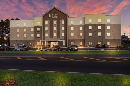 a large building with cars parked in front of it at MainStay Suites Murfreesboro in Murfreesboro