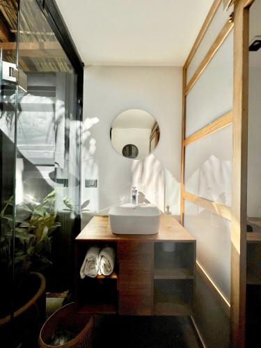 a bathroom with a sink and a mirror at H20 Hotel Container in San Agustinillo