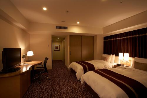 Ένα ή περισσότερα κρεβάτια σε δωμάτιο στο Hotel Ryumeikan Tokyo