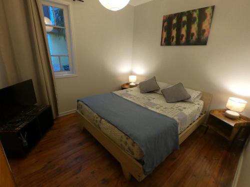 Ένα ή περισσότερα κρεβάτια σε δωμάτιο στο Escarabajo Hostel