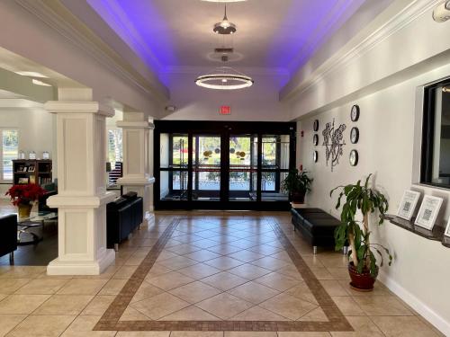a lobby with a blue light on the ceiling at Days Inn & Suites by Wyndham Lakeland in Lakeland