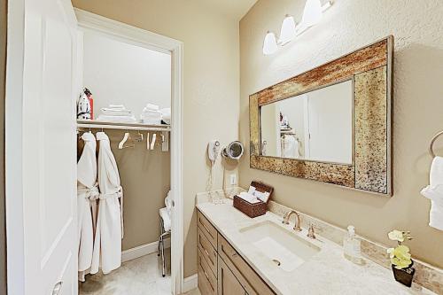a bathroom with a sink and a mirror at Century Oak House in Spring Branch
